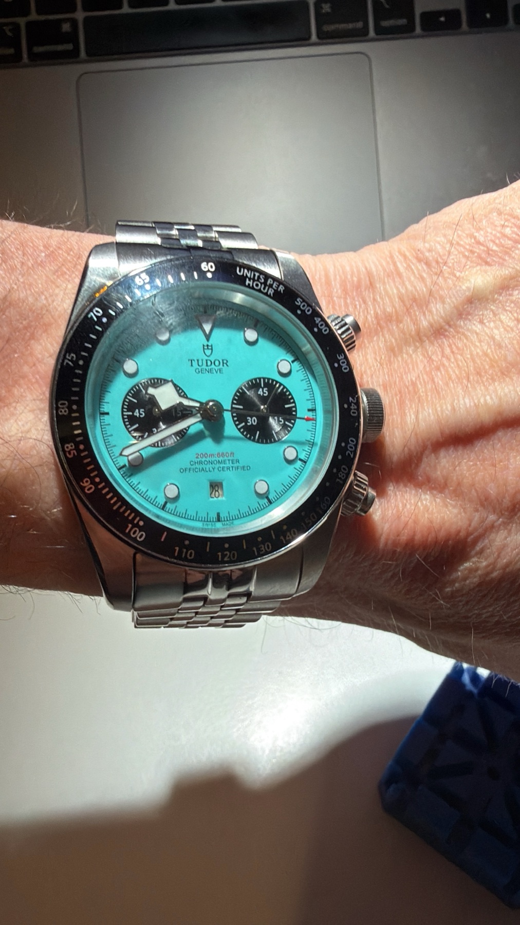 Turquoise Tudor chronograph on Jamie's wrist